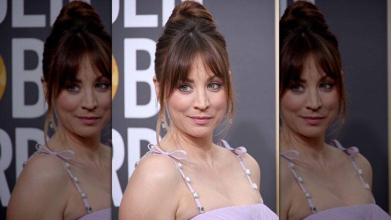 Kaley Cuoco with brunette hair wearing wispy curtain bangs and an updo