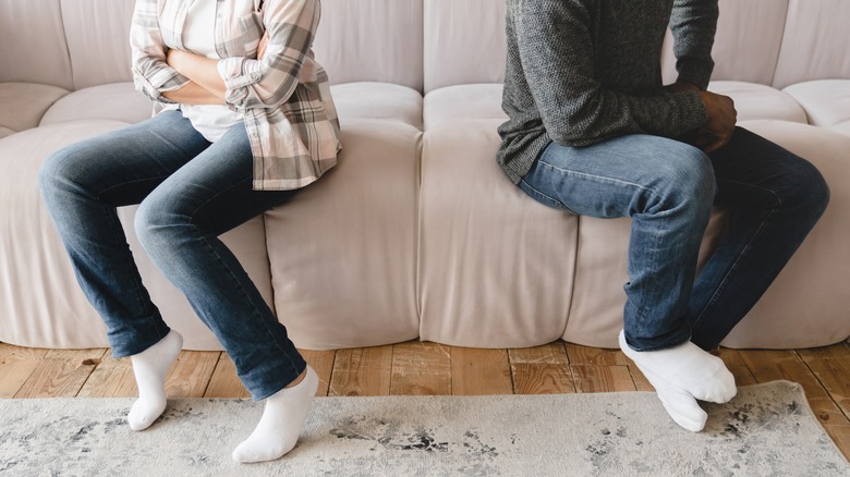 Two people on the opposite side of the couch