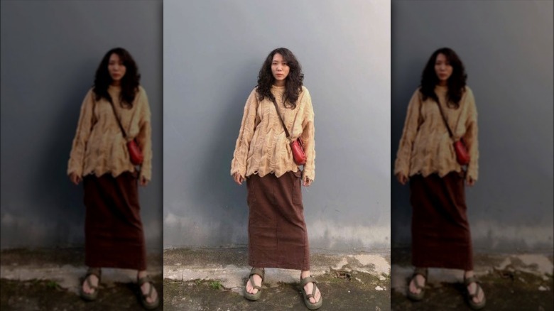 Woman wearing brown cargo maxi skirt