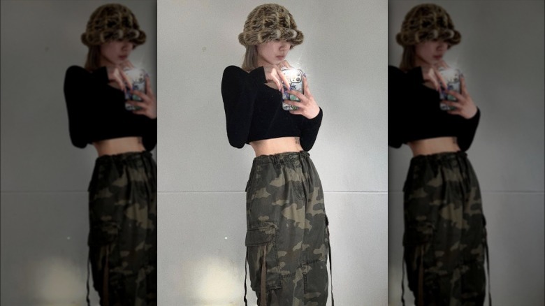 Woman wearing camo print cargo skirt