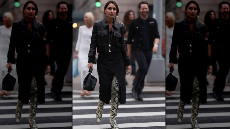 woman wearing snake over-the-knee boots