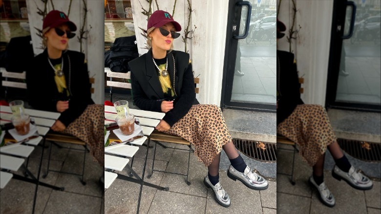 Person in leopard skirt, loafers