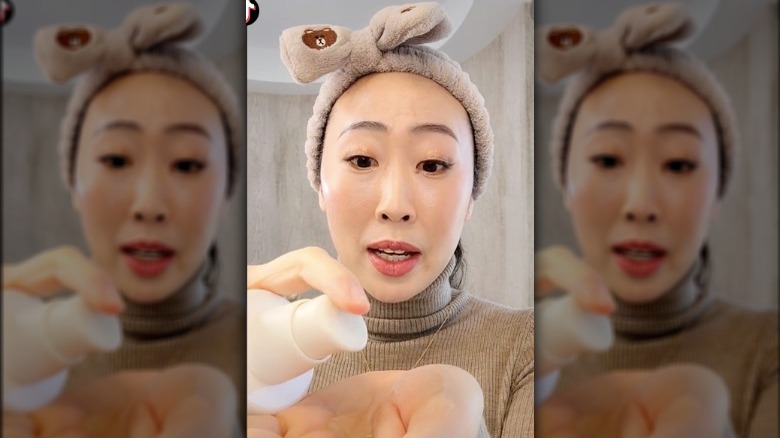 Woman using oil cleanser