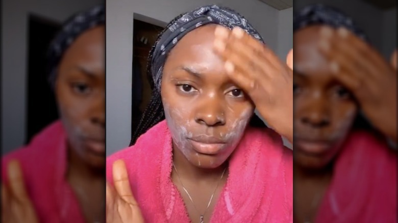 Girl washing her face