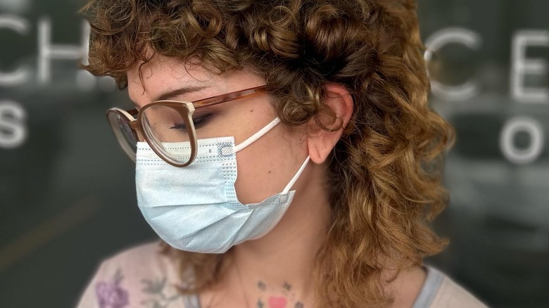 A masked woman with a shullet