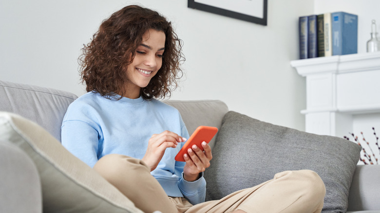 A woman looking at her phone