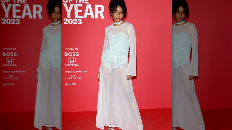 woman in sheer dress and bodysuit