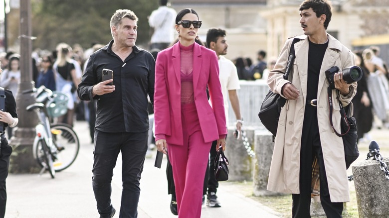 woman wearing sheer top and suit