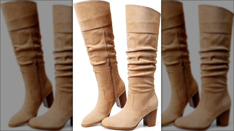 A pair of suede knee-high boots perfect for fall 2025