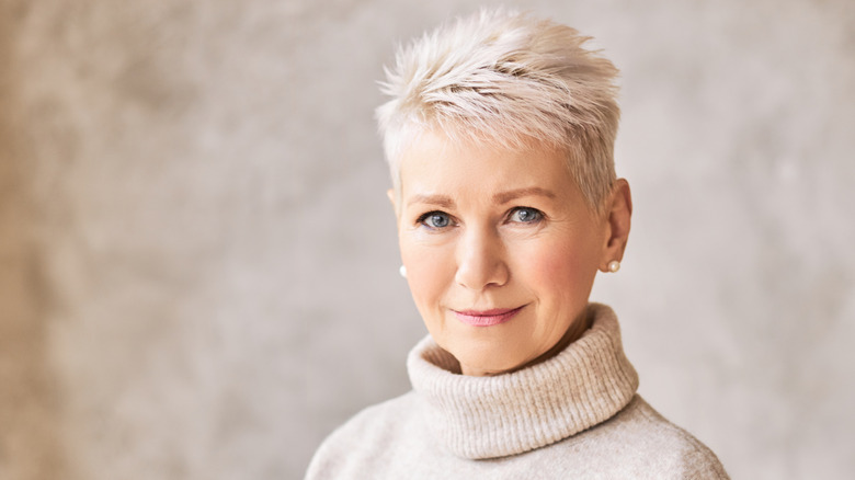 A woman with textured, layered pixie cut