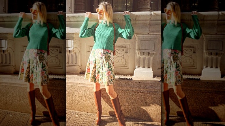 green sweater and colorful dress