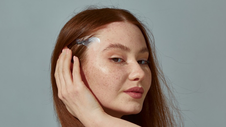 woman using face tape