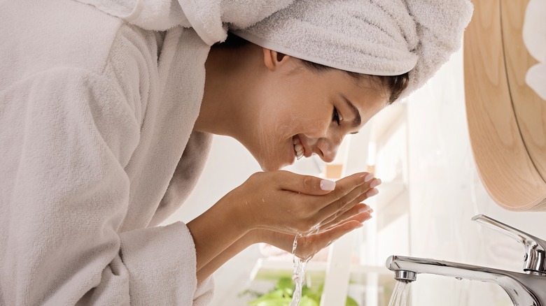 woman washing face