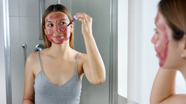 woman using peeling chemical exfoliator