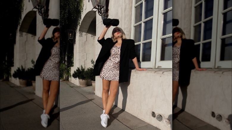 Woman wearing mini dress and blazer