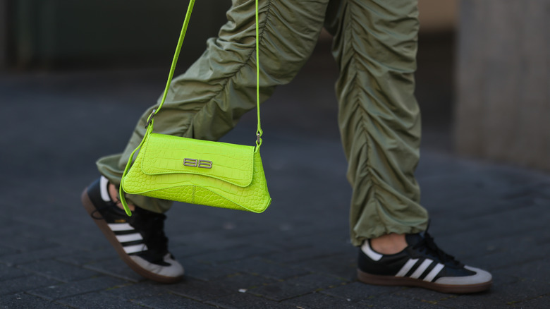 close up of woman wearing Adidas samba sneakers