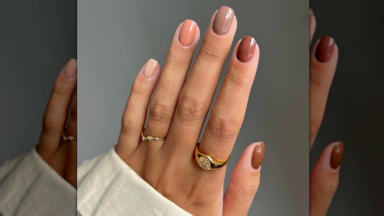 Hand with earthy manicure