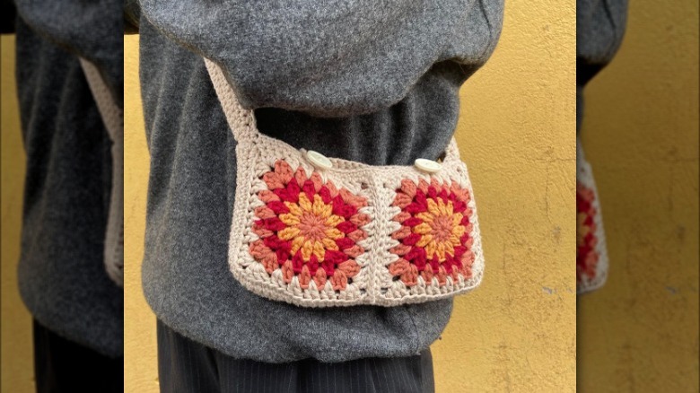 Closeup of crossbody bag on woman's side 