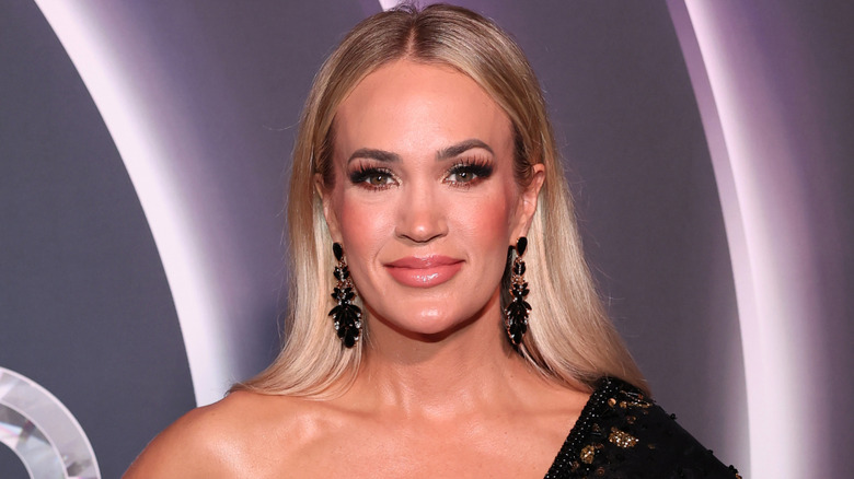 Carrie Underwood with sleek waved blond hair