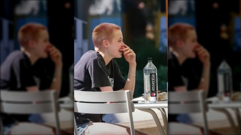 Shiloh Jolie-Pitt with pink buzzcut