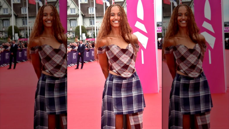 Malia Obama wearing plaid Vivienne Westwood separates on the red carpet.