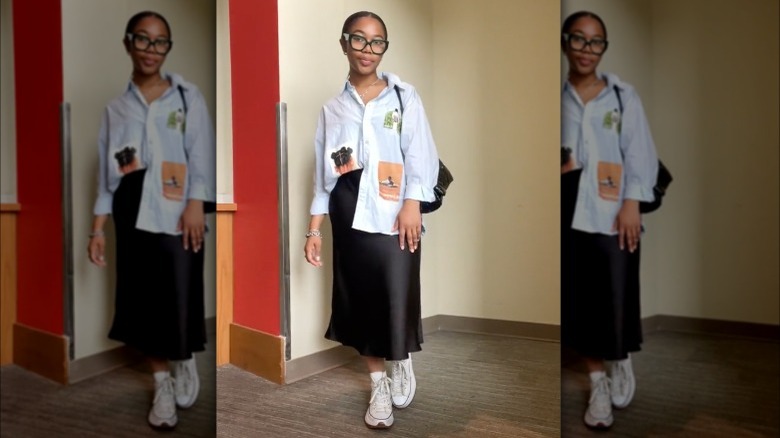 Woman wearing midi skirt with Converse