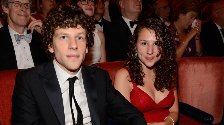 Jesse Eisenberg and Hallie Eisenberg sit next to each other at an awards show
