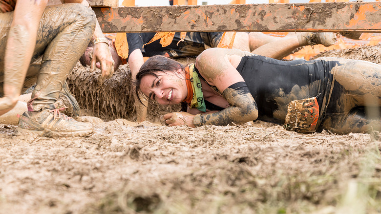 participant doing a tough mudder race