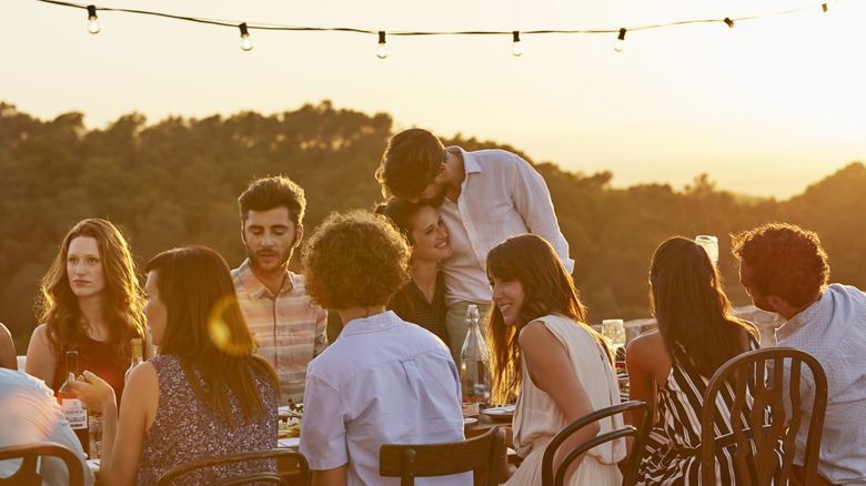 friends eating at dinner party