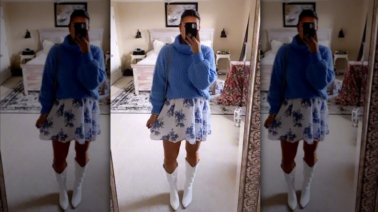 Woman wearing sweater over dress