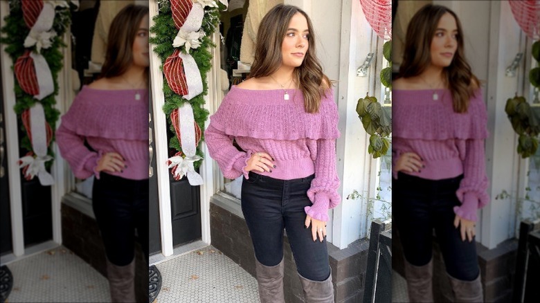 Individual in a purple bell-sleeved sweater