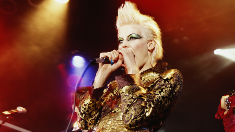 Woman signs on stage 
