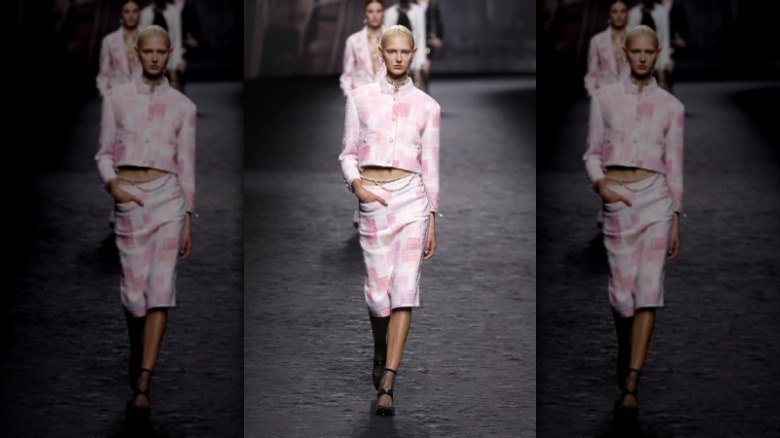 model with waist chain Chanel runway