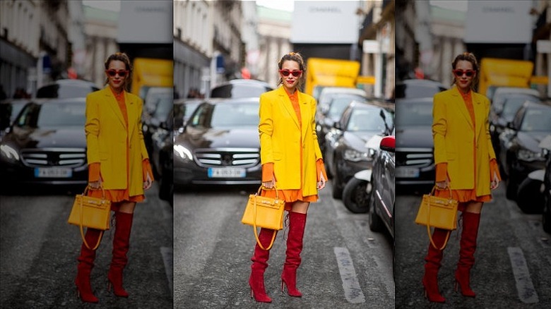 woman wearing dress and red boots