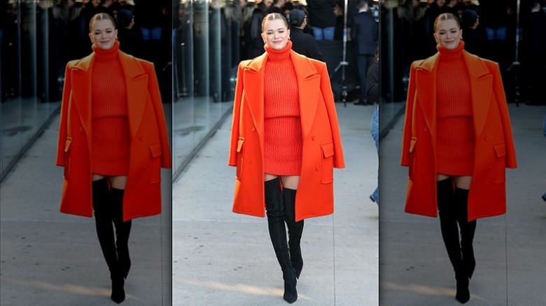 woman wearing turtleneck dress and blazer