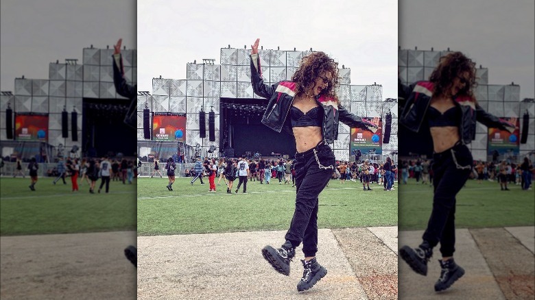 Girl wearing a biker jacket.
