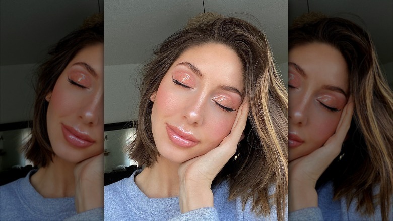 woman with glossy lips and eyes