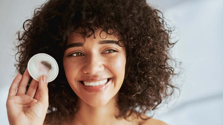 Woman removing makeup
