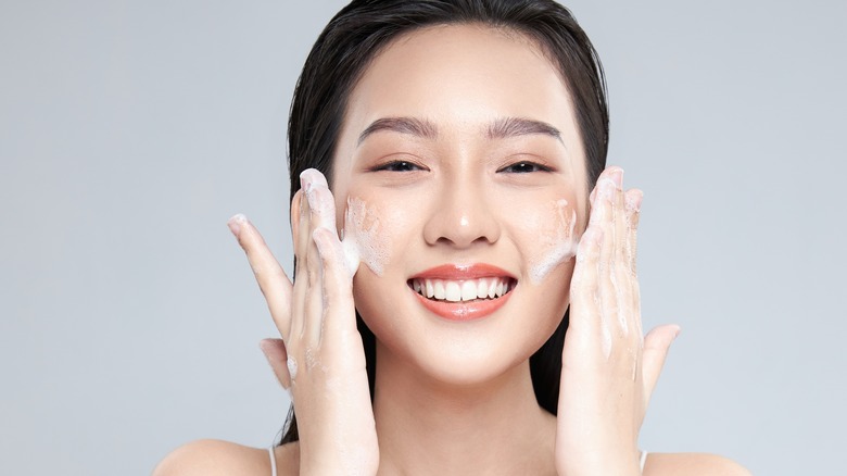 Woman washing her face