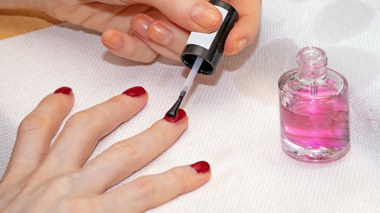Woman doing top coat