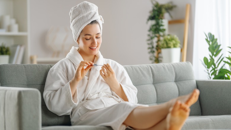 Woman doing nails at home