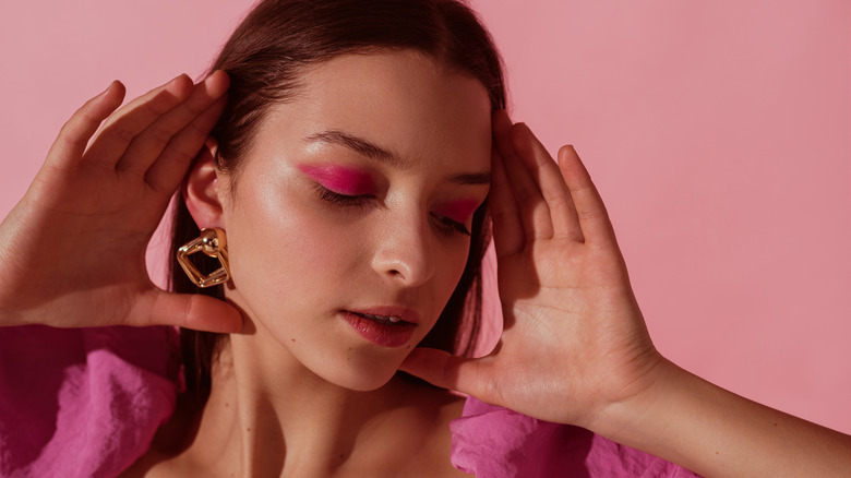 Woman wearing pink eye shadow