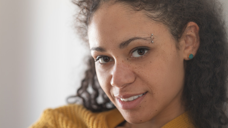 woman with eyebrow piercing