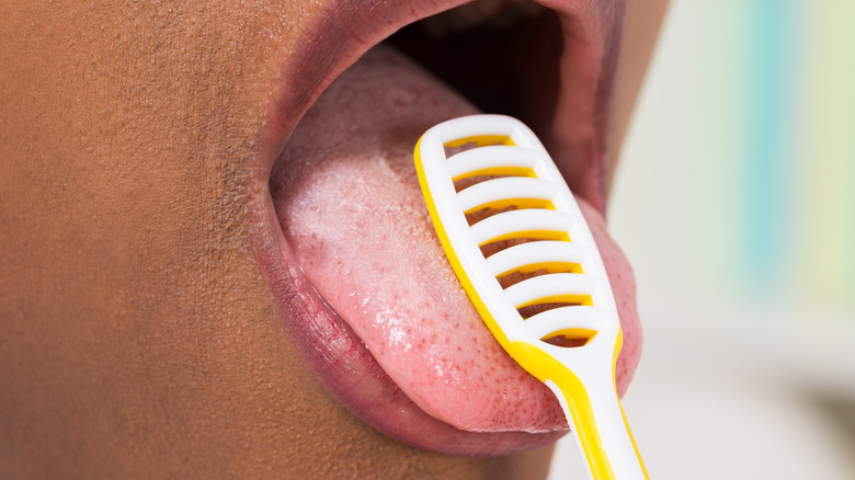 tongue cleaner african american man