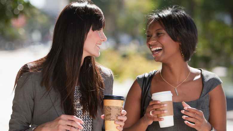 happy women looking at each other