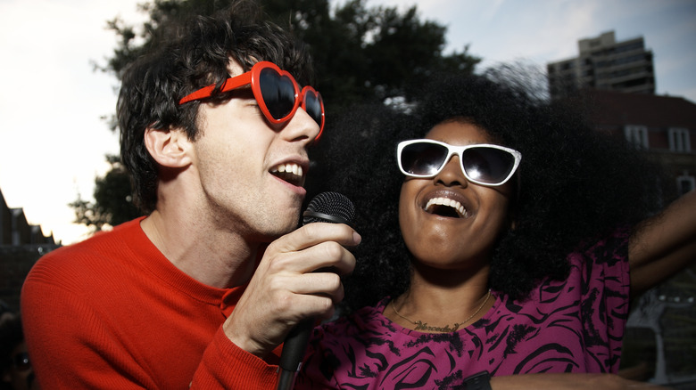 man and woman singing