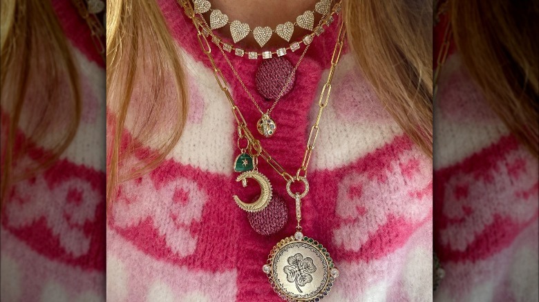 Woman wearing mixed metal necklaces