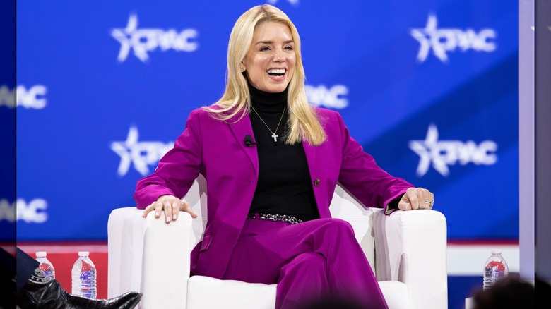 Pam Bondi wearing a magenta suit and turtleneck