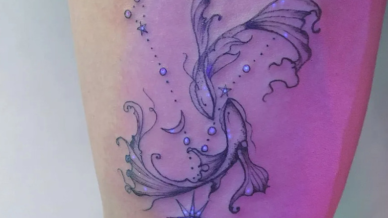 glow-in-the-dark pisces tattoo