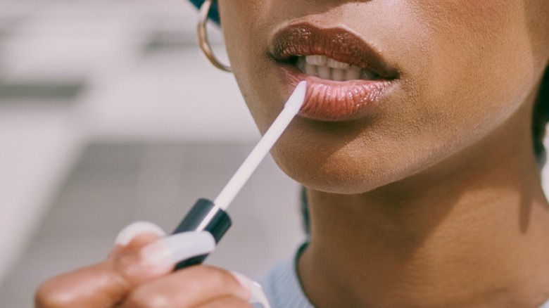 Person applying lip product